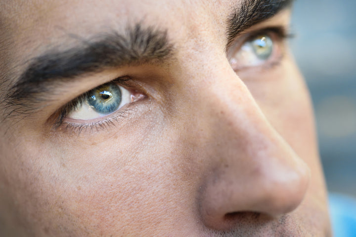 How to Get Rid of Under Eye Wrinkles. Close up of handsome man with blue eyes