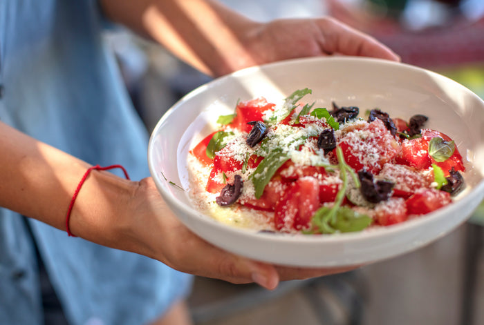 Can the Mediterranean Diet Reduce Hair Loss? Plate of Tomato, Parmesan Cheese and Fresh Mint Salad