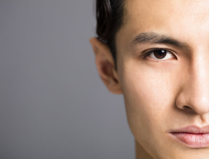 refined pores - Half face image of handsome young man with perfect skin
