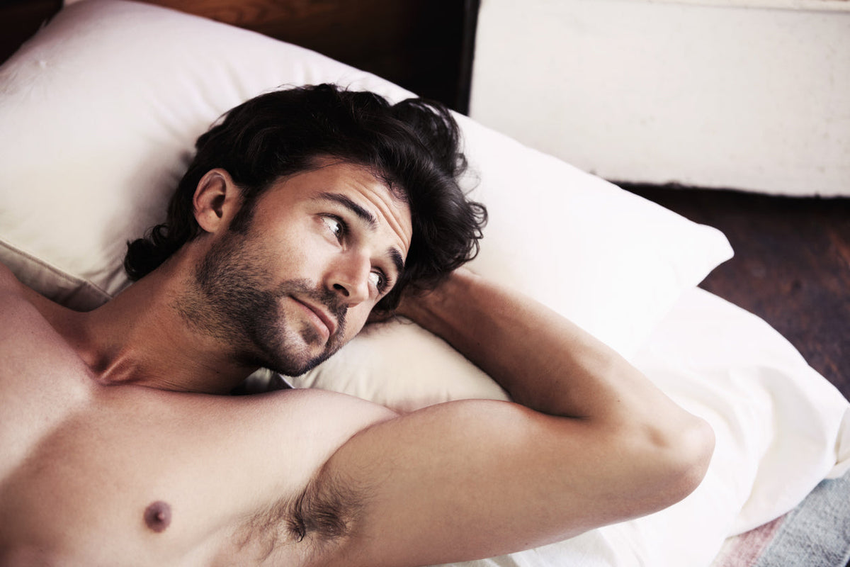 Handsome man in bed trying to sleep. the connection between collagen and sleep. Image of collagen structure