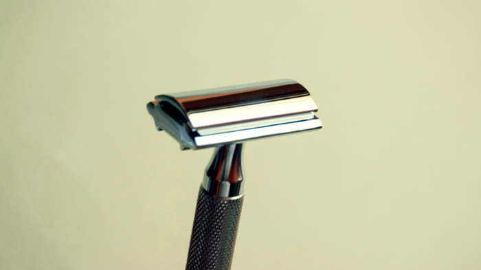 Why Your Shaving Routine Might Be Causing Redness - And How to Stop It. Close up of razor head