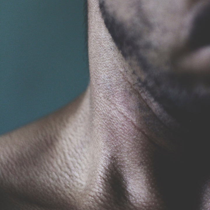 man with sensitive skin on his neck in close up