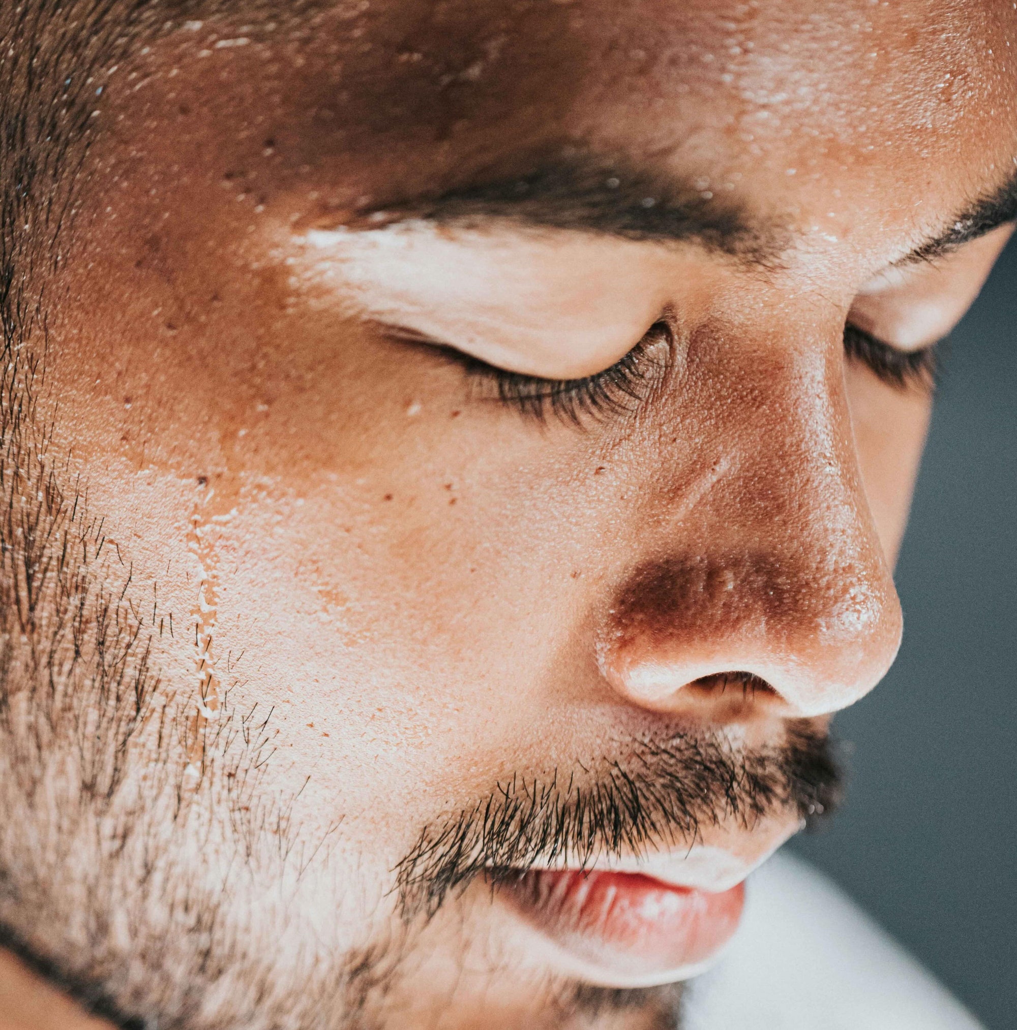 Skincare for Gym-Goers: Protecting Your Skin from Sweat and Bacteria. Close up of man's face with sweat