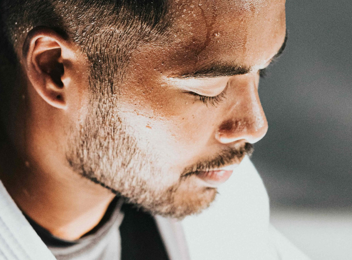 Testosterone Isn't What's Wrecking Your Skin. Close up of  handsome man with shiny  face from exercising